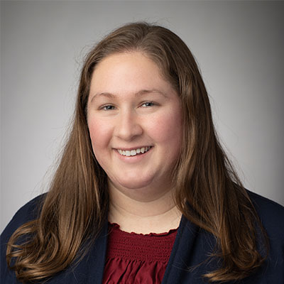 Portrait of Anne Longhibler wearing a blazer.