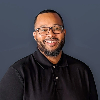 Portrait of Derick Jolliff-Cunigan wearing a black casual shirt