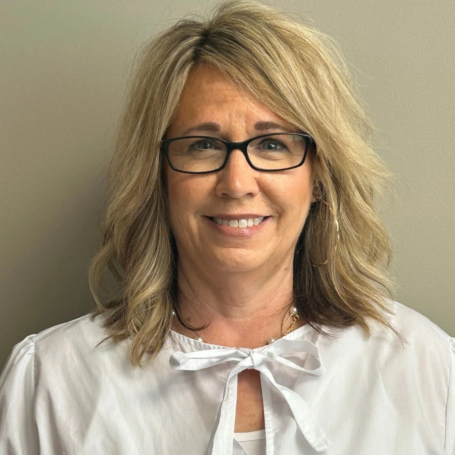 Portrait of Stacie Withers wearing a white blouse.